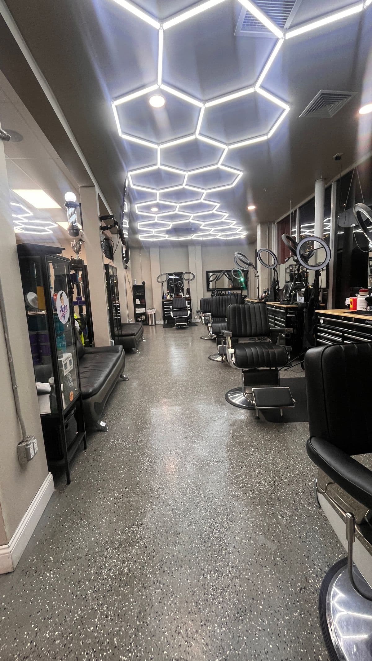 Interior view with barber chairs and waiting area